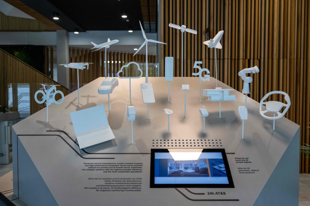 An installation shows examples of applications using AT&S products at the company’s headquarters in Leoben, Styria, Austria, on August 11, 2026. — AFP pic