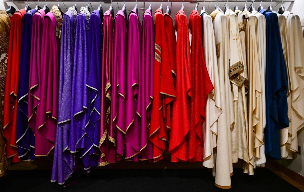 This picture shows liturgical vestments at the LAVS (Laboratorio Arte Vesti Sacre) Italian atelier specialized in sacred vestments, founded in 2001 by artist and designer Filippo Sorcinelli, in Santarcangelo di Romagna, central Italy, on August 21, 2026. — AFP pic