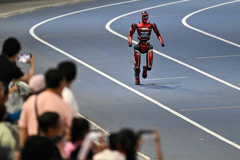 A humanoid robot competes on the first day of the 2nd World Humanoid Robot Games in Beijing on August 22, 2026. — AFP pic