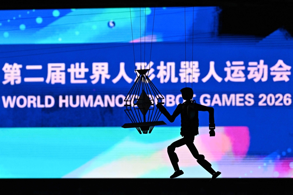 A humanoid robot takes part in the opening ceremony of the 2nd World Humanoid Robot Games in Beijing on August 22, 2026. — AFP pic