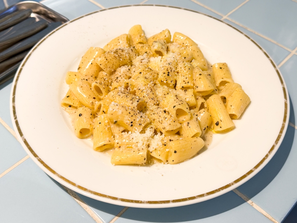 Pasta dishes like this Cacio E Pepe are simple and not overburdened with ingredients, allowing one to relish the texture of the pasta coated with a silky cheese sauce dotted with black pepper. — Picture by Lee Khang Yi 
