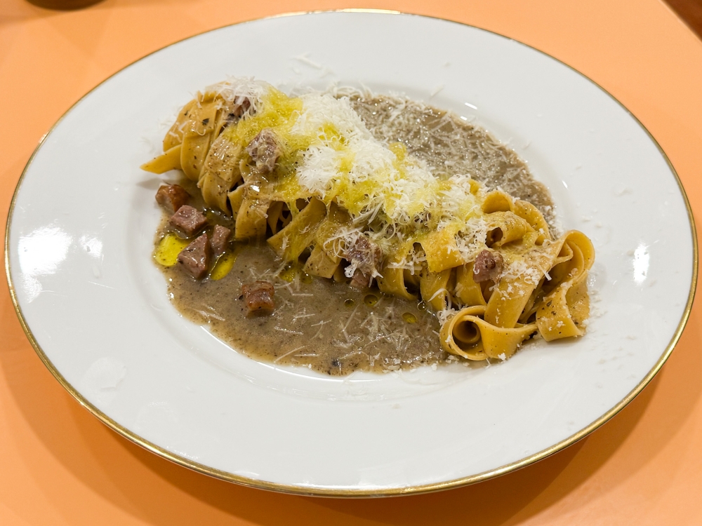 Unfurl the tagliatelle to mix that rich truffle sauce with smoked duck cut in cubes for a satisfying lunch. — Picture by Lee Khang Yi 