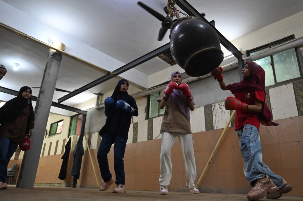 This photograph taken on July 7, 2026 shows young boxers practicing during a sparring session at a local boxing club in Karachi’s Lyari town. — AFP pic 