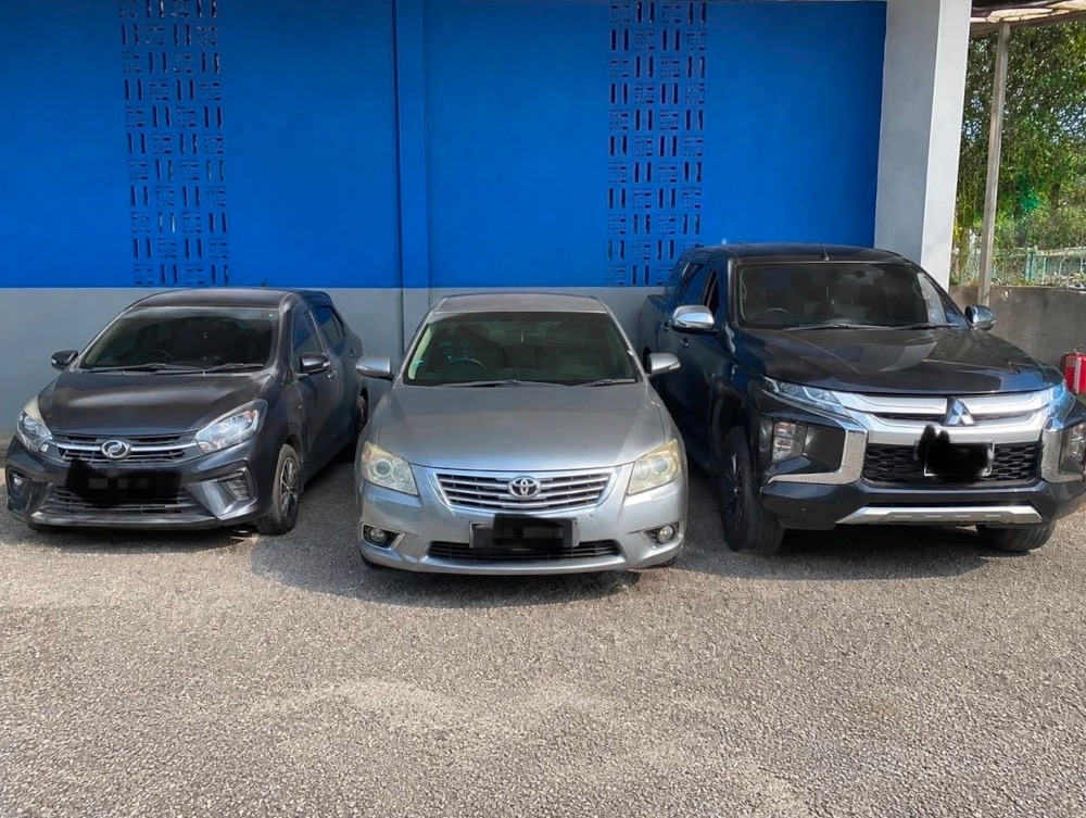The three vehicles that police seized after arresting 12 men suspected to have been involved in a brawl at Taman Kota Jaya in Kota Tinggi earlier today, August 26, 2026. — Picture courtesy of the Kota Tinggi district police
