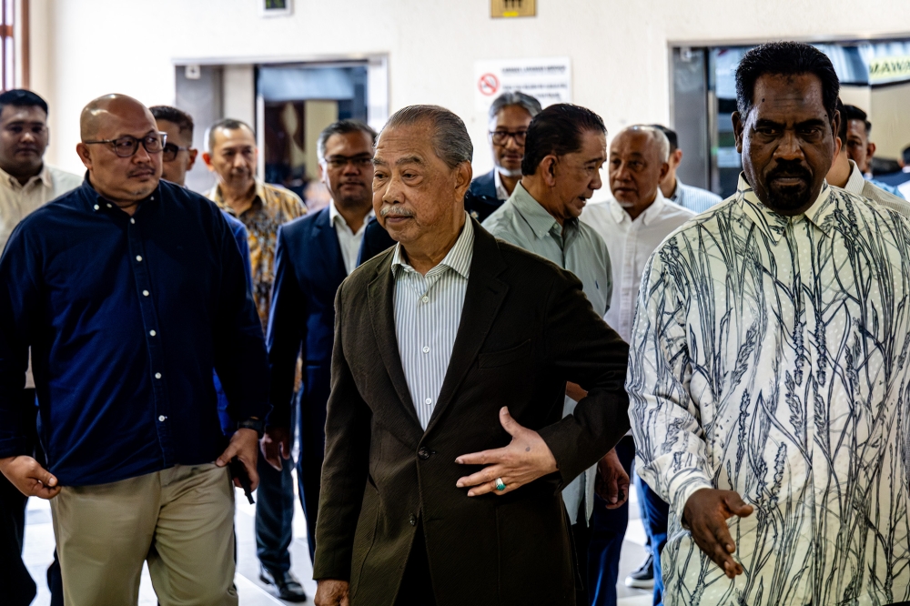 Former Prime Minister, Tan Sri Muhyiddin Yassin after arriving at the Kuala Lumpur High Court Complex. — Picture by Firdaus Latif