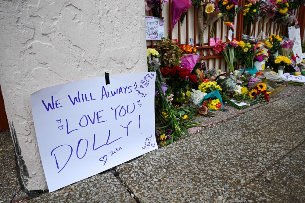 Flowers and notes are left outside Dolly Parton’s studio on Elmwood Street in Nashville, Tennessee August 26, 2026. — AFP pic