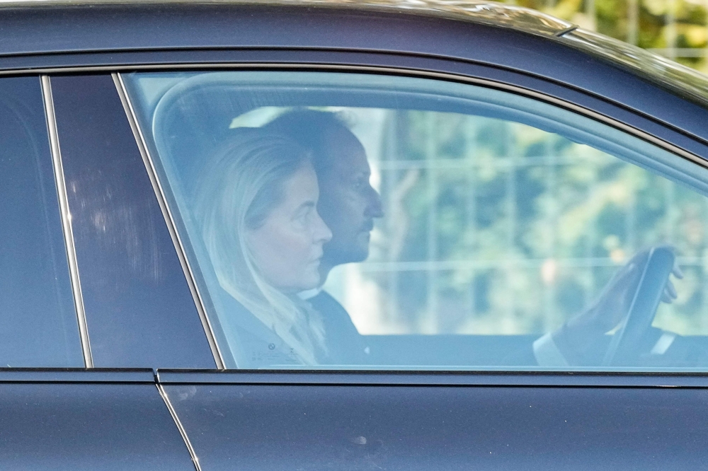 Crown Prince Haakon of Norway (right) and Crown Princess Mette-Marit of Norway sit in a car as they arrive at the Rikshospitalet hospital, where King Harald V of Norway is hospitalised August 27, 2026. — Cornelius Poppe/NTB/AFP pic