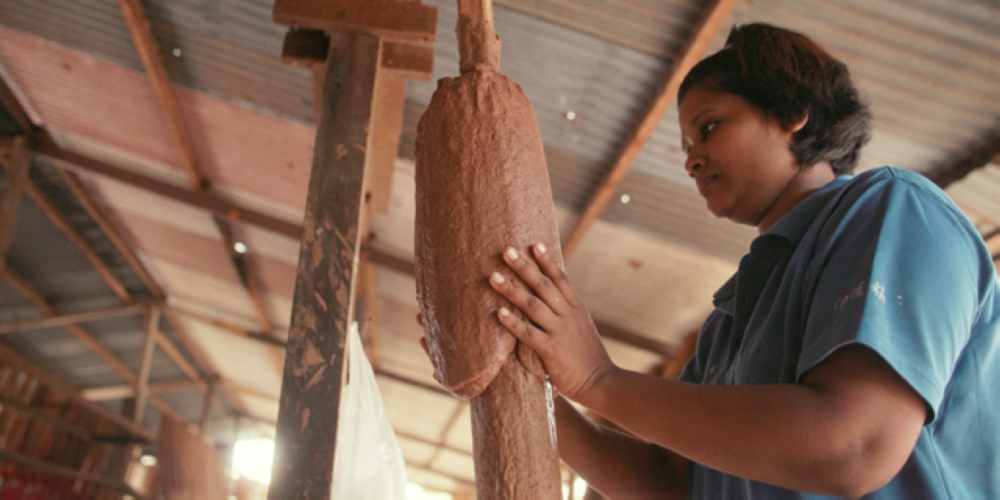 A worker putting on a layer of joss paste. — Picture courtesy of Penang Global Tourism