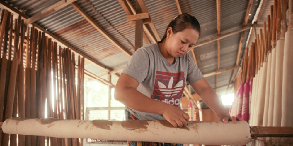 A worker pasting components on a joss stick. — Picture courtesy of Penang Global Tourism