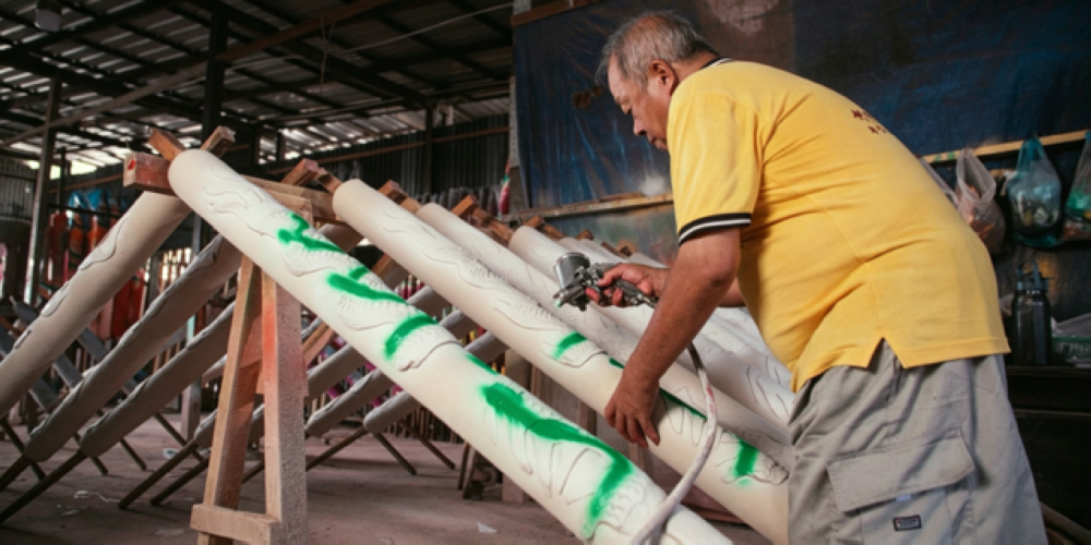 Ong Chin Chye spray painting the joss stick. — Picture courtesy of Penang Global Tourism