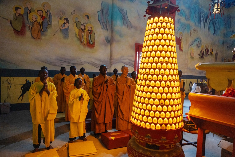 Shaolin temple students and monks perform a prayer  at a Shaolin Temple outside Lusaka, on August 8, 2026. — AFP pic
