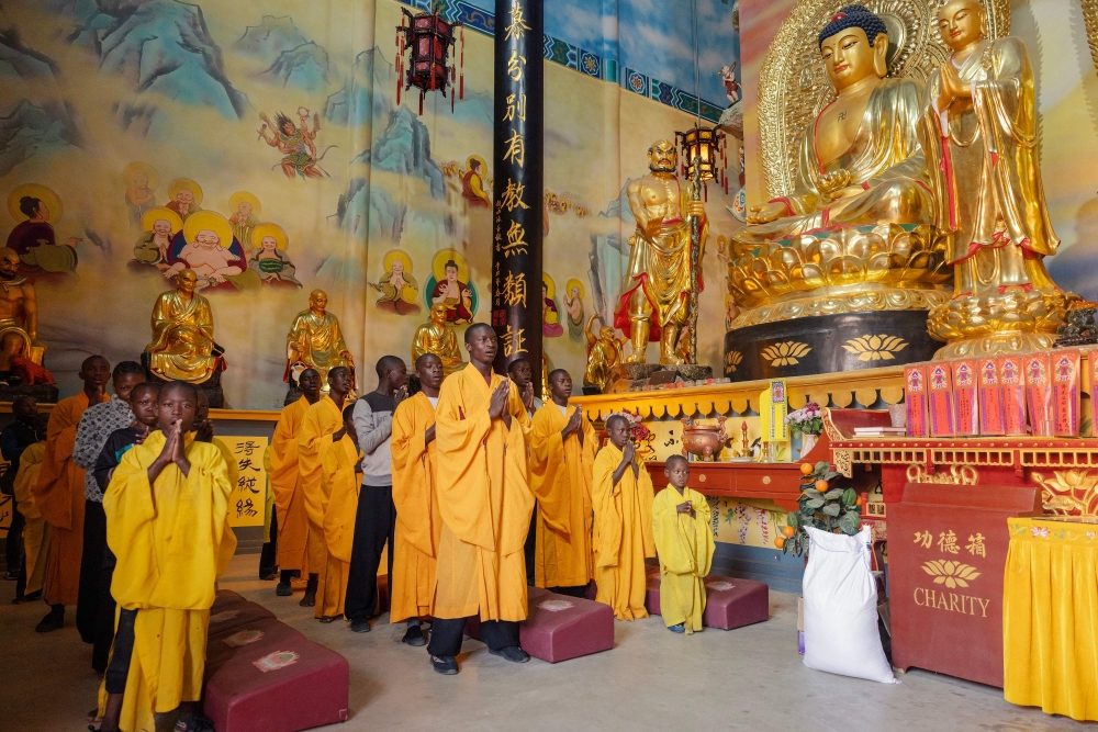Shaolin temple students and monks perform a prayer at a Shaolin Temple outside Lusaka, on August 8, 2026. — AFP pic