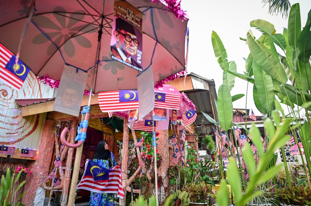 Red, white, blue and yellow take over Kitam Mat Deris’ home as she goes all out to celebrate Merdeka. — Bernama pic