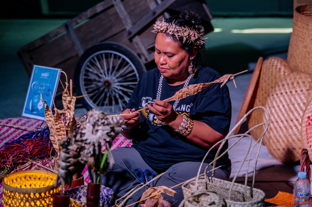 An artisan demonstrates traditional weaving during the ‘Jiwa Merdeka’ preview at Ombak KLCC in Kuala Lumpur, Aug 28, 2026. — Picture by Firdaus Latif