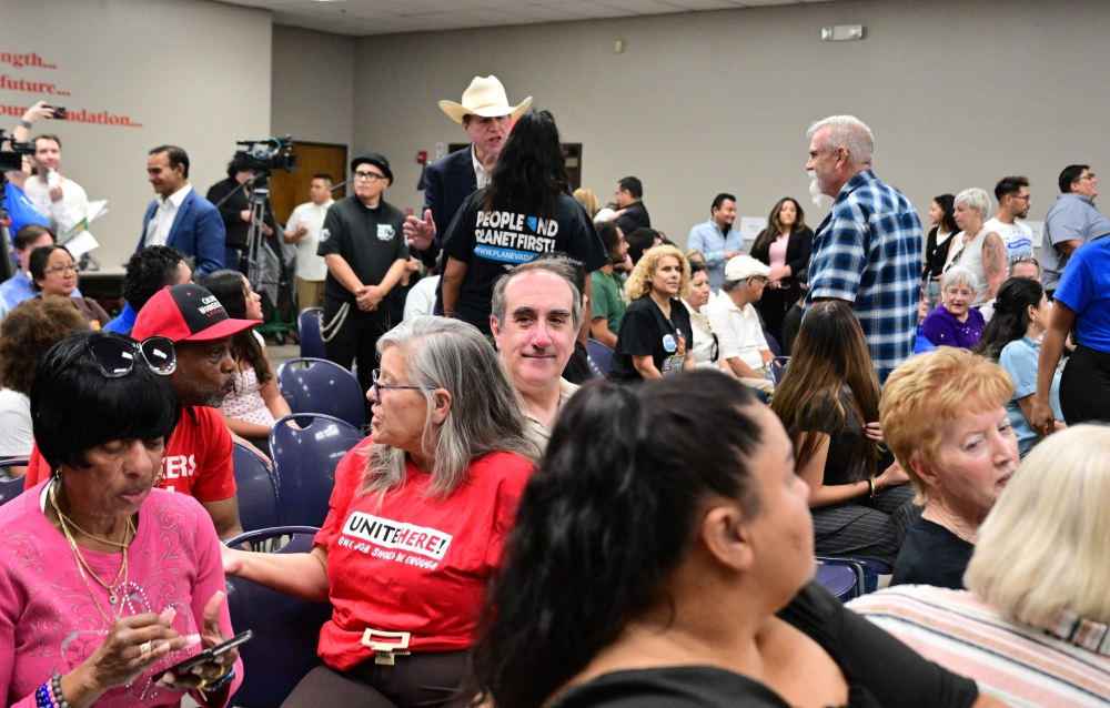 Aaron Mahan (centre), a Las Vegas Strip worker who considers himself a victim of what he calls the ‘Trump slump’, attends a town hall meeting in Las Vegas, Nevada, on August 19, 2026. — AFP pic

