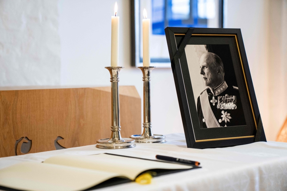 The book of condolences and a photograph of late King Harald V are seen at the Norwegian Embassy in Nordhavn, Copenhagen, on August 28, 2026, following the monarch’s death at the age of 89. — Ritzau Scanpix via AFP