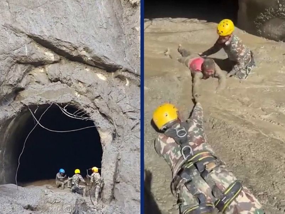 Nepali soldiers pull out a person trapped inside a hydropower tunnel following flash floods in Rasuwa district, Nepal, in these screengrabs from a video released by Nepal’s Prime Minister Secretariat on August 28, 2026. — Nepal Prime Minister Secretariat handout images via AFP
