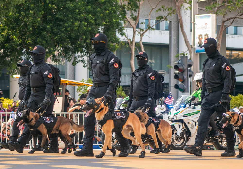 Malaysia Prison Department K9 unit steps out in sunglasses and shoes during National Day parade at Dataran Putrajaya, August 31, 2026. — Bernama pic