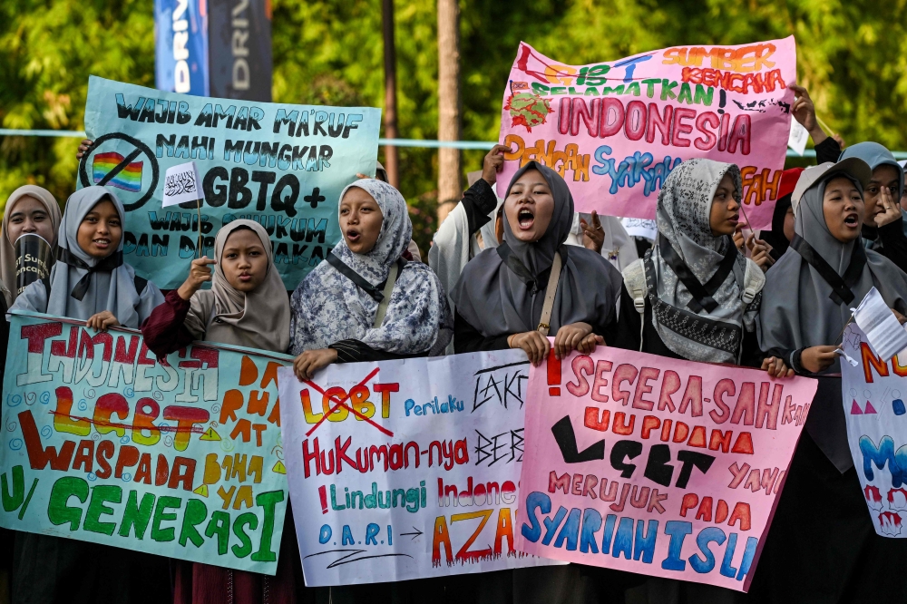 Demonstrators take part in an anti-LGBTQ rally organised by pro-Islamic organisations in Surabaya on August 9, 2026. — AFP pic