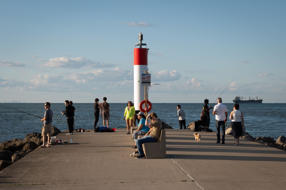 People gather on a pier on Lake Ontario on August 28, 2026 in St. Catherines, Canada. U.S. President Donald Trump signed an executive order to rename Lake Ontario as ‘Lake America’ amid an ongoing trade war between the US and Canada. — AFP pic