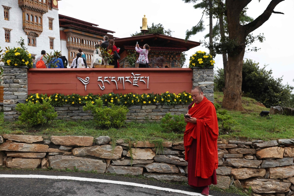 A monk arrives to attend the Global Conscious Food Systems Summit in Paro, Bhutan on September 1, 2026. — AFP pic