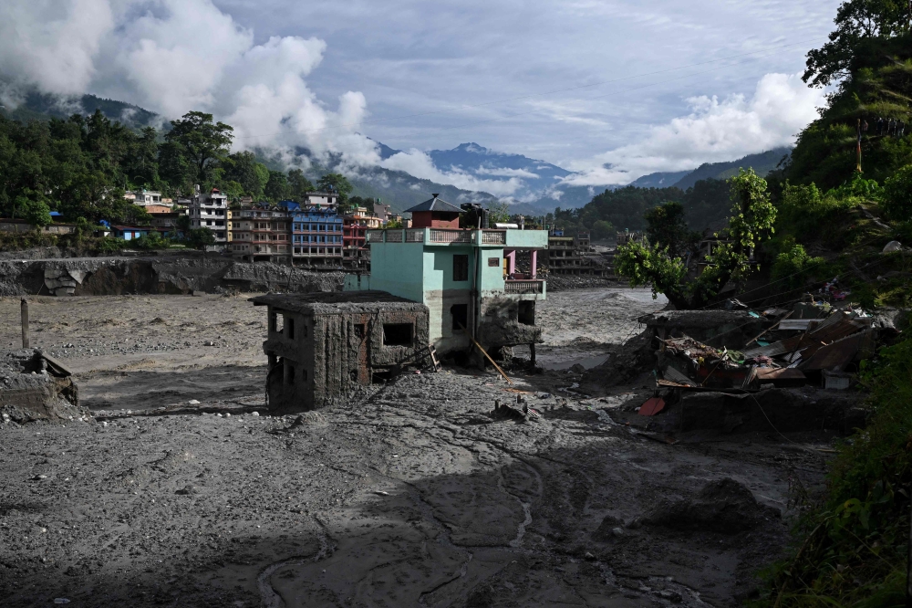 A turquoise-green house stands tall amid sludge near Trishuli river in the aftermath of flash floods at Trishuli Center in Nepal’s Nuwakot district September 2, 2026. — AFP pic 