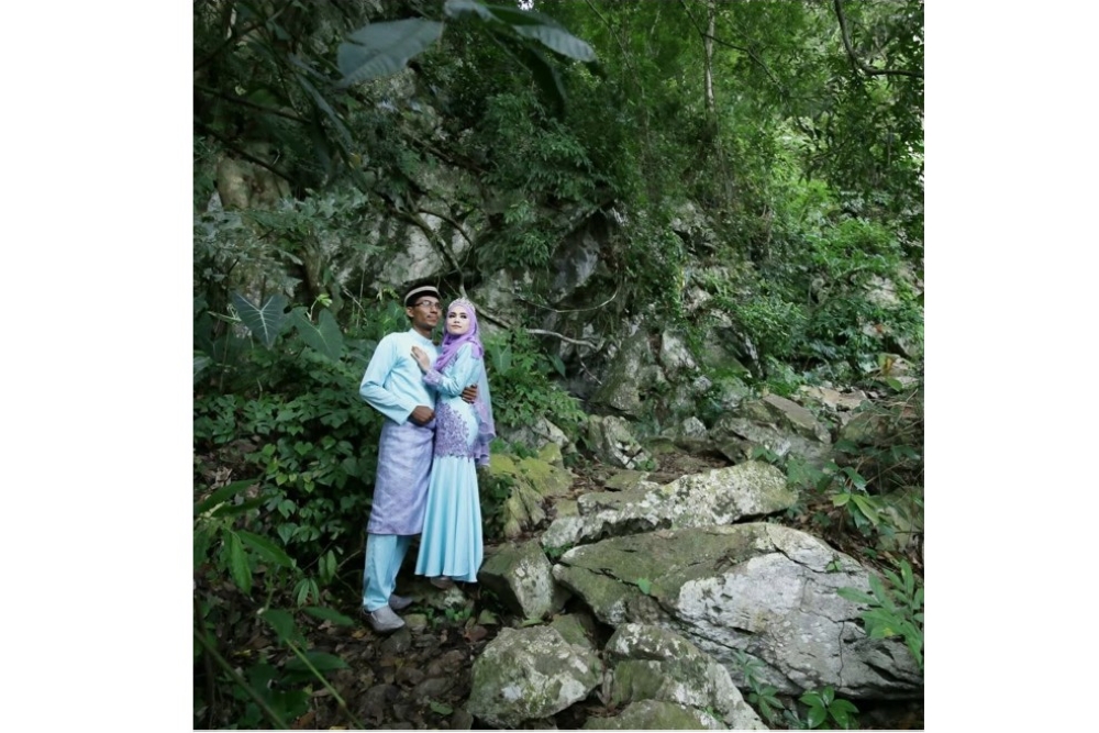 Senior Fire Officer II Mohd Fakhrul Munir Mohd Isa, who remains missing following floods in Nepal, is pictured with his wife, Hani Othman. — Picture via Facebook/Hani Othman