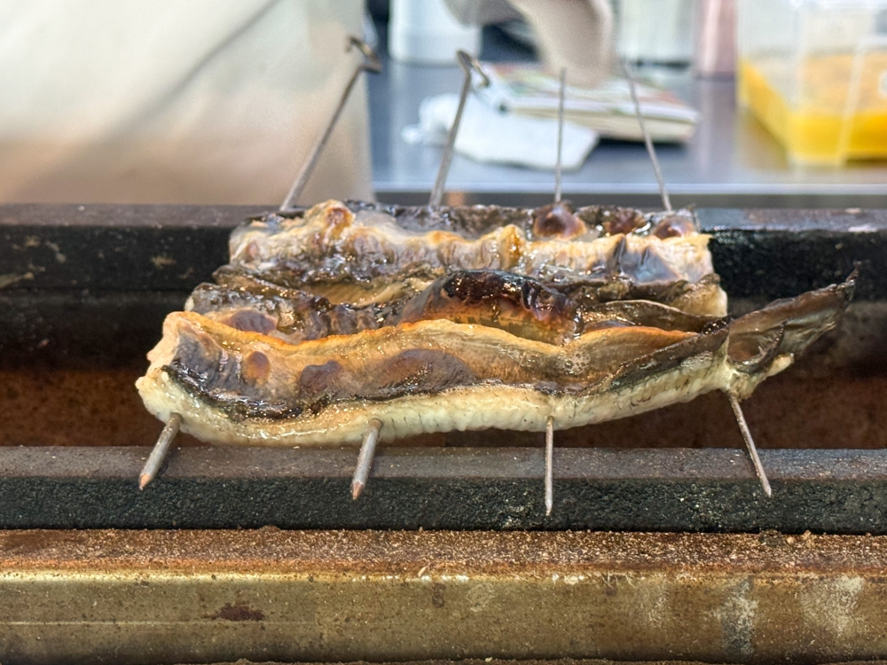 The 'unagi' is prepared Nagoya-style, where the 'live' eel is grilled over a charcoal fire and not steamed. 
