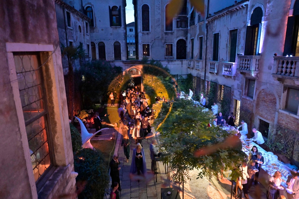 Guests attend a ball for the inauguration of the Palazzo Bragadin, a former residence of fashion designer Pierre Cardin turned into a museum, in Venice on September 3, 2026. — AFP pic