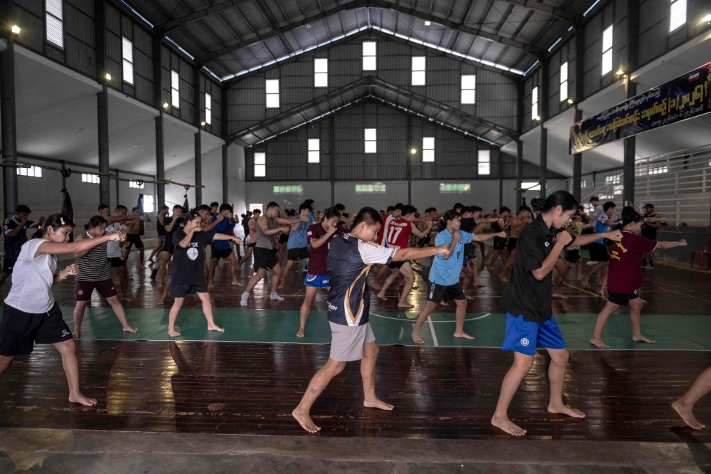 Fighters training in traditional Myanmar boxing known as Lethwei at a training camp in Hpa-an in Myanmar's Karen state. — AFP pic