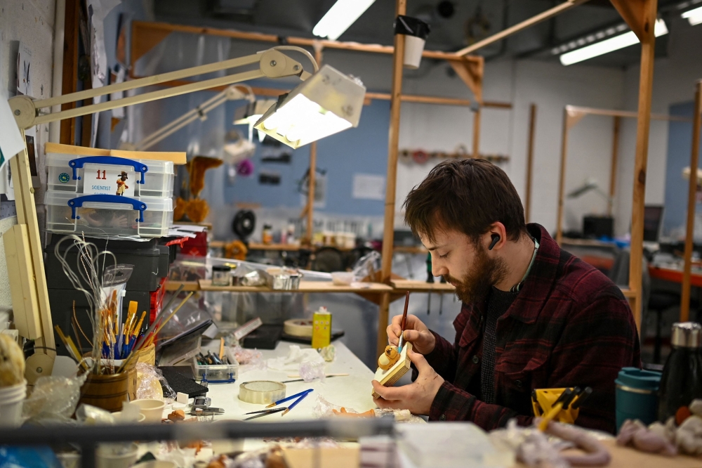 An animator working at Aardman Animations studios in Bristol. — AFP pic