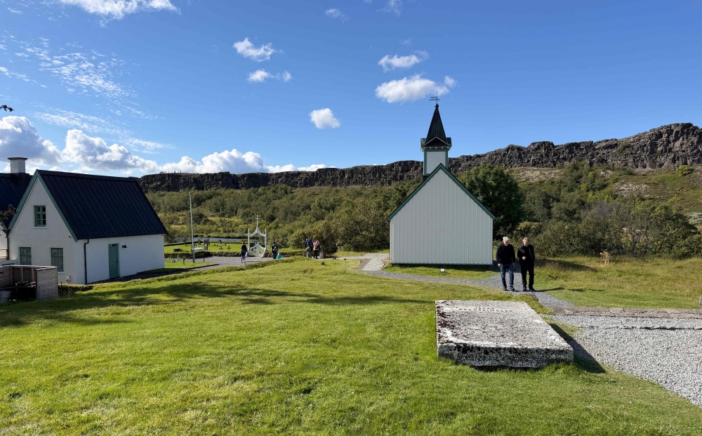 Neurologist Kari Stefansson walks towards the grave of poet Jonas Hallgrimsson in Thingvellir, on August 28, 2026. In a small enclosure of lava stones in a grassy field, a modest tombstone bears the name of an Icelandic legend: Jonas Hallgrimsson. But are the bones beneath it really those of the poet, or a Danish grocer? Hallgrimsson is an icon in his country: a beloved poet and naturalist, a craftsman behind the renewal of the Icelandic language, and one of the founders of Icelandic national romanticism. — AFP pic