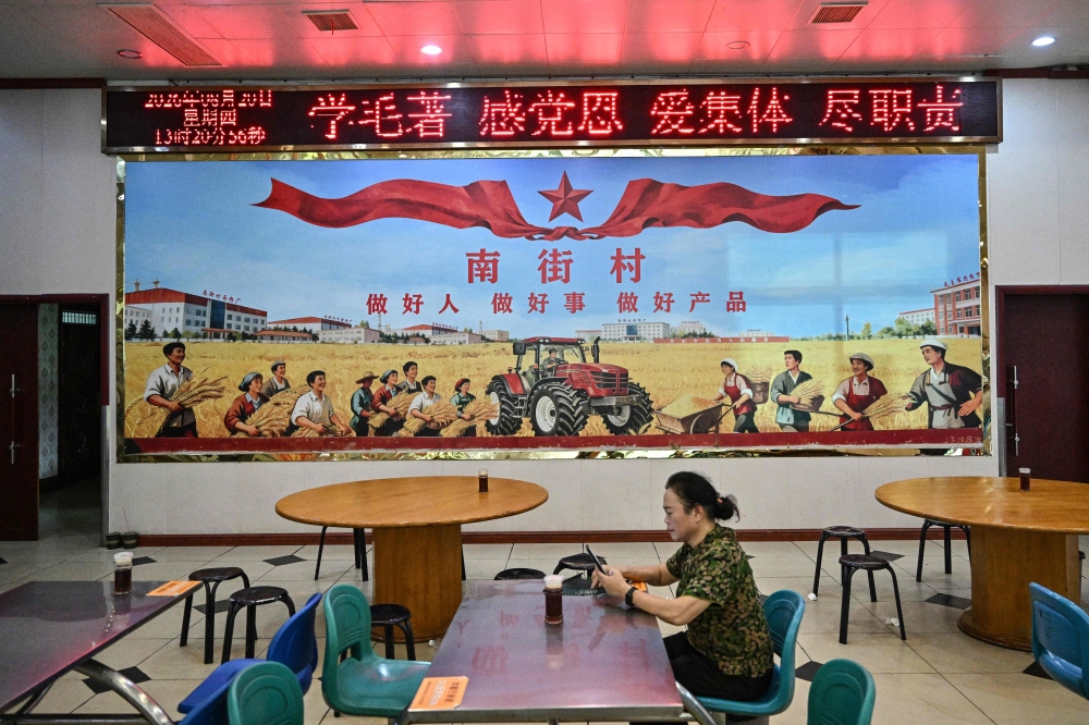 A socialist‑inspired mural at a restaurant in Nanjie Commune, Henan province, August 20, 2026. — AFP pic