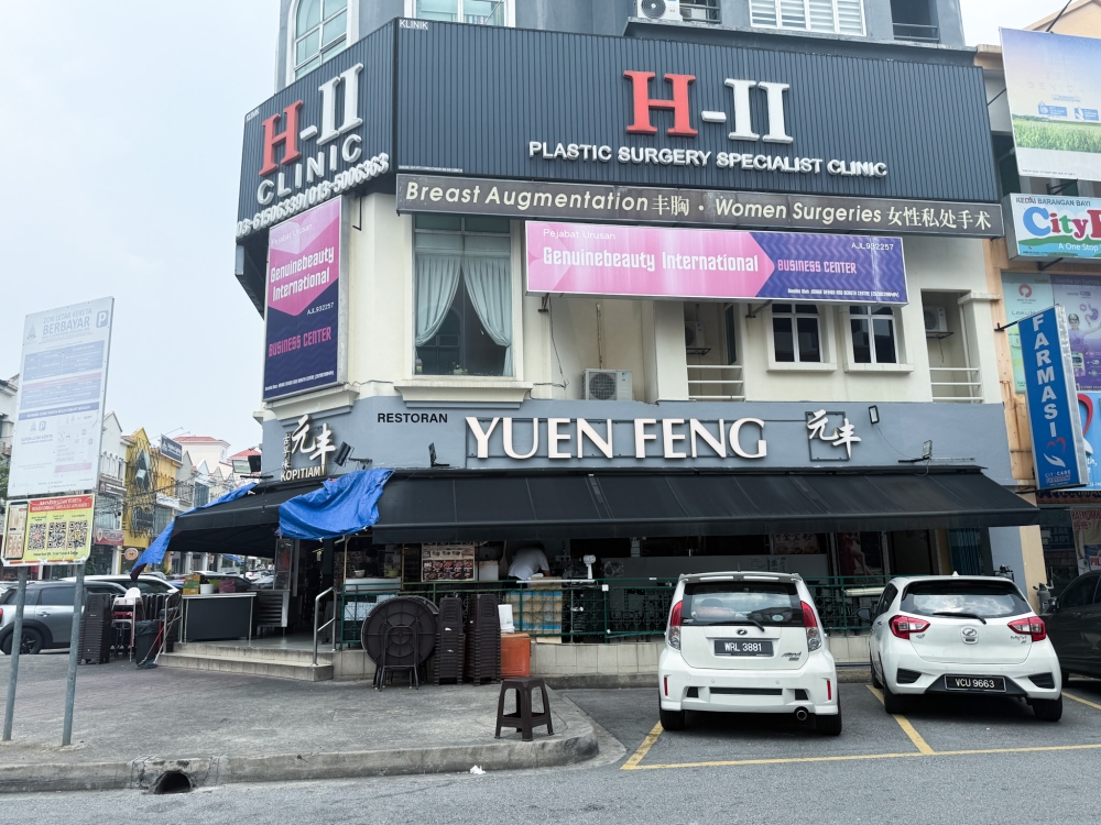 The coffee shop has two locations: this corner shop and another opposite it, which has many stalls offering a large variety of food. — Picture by Lee Khang Yi