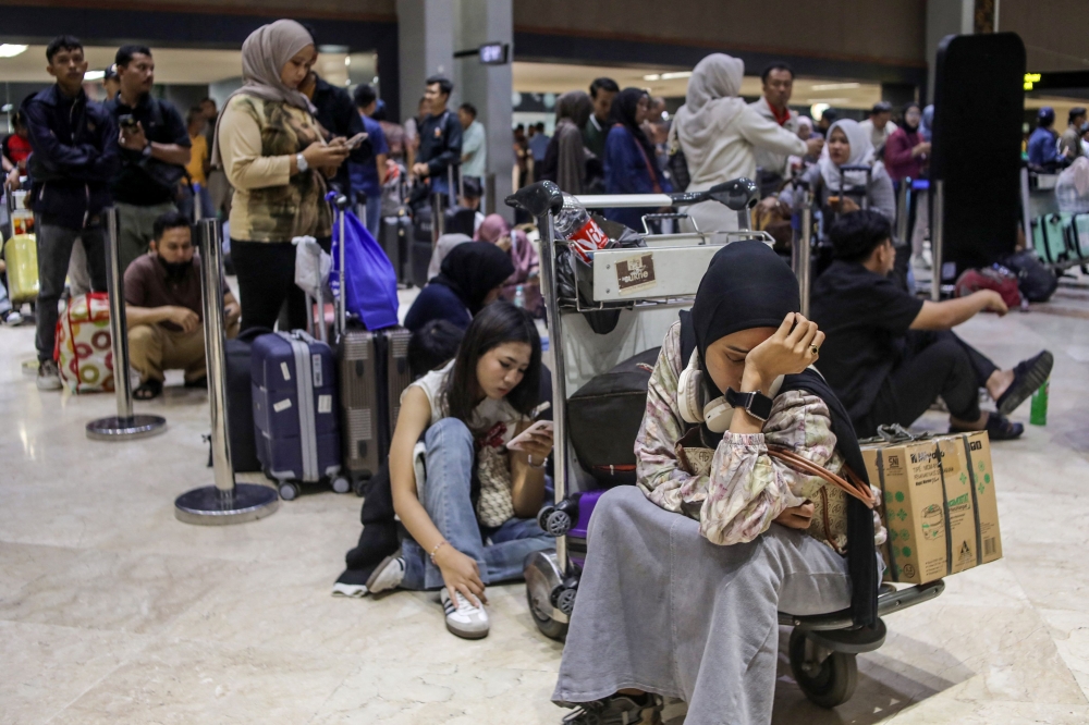 Stranded by volcanic ash, Malaysians in Jakarta find free beds and open arms