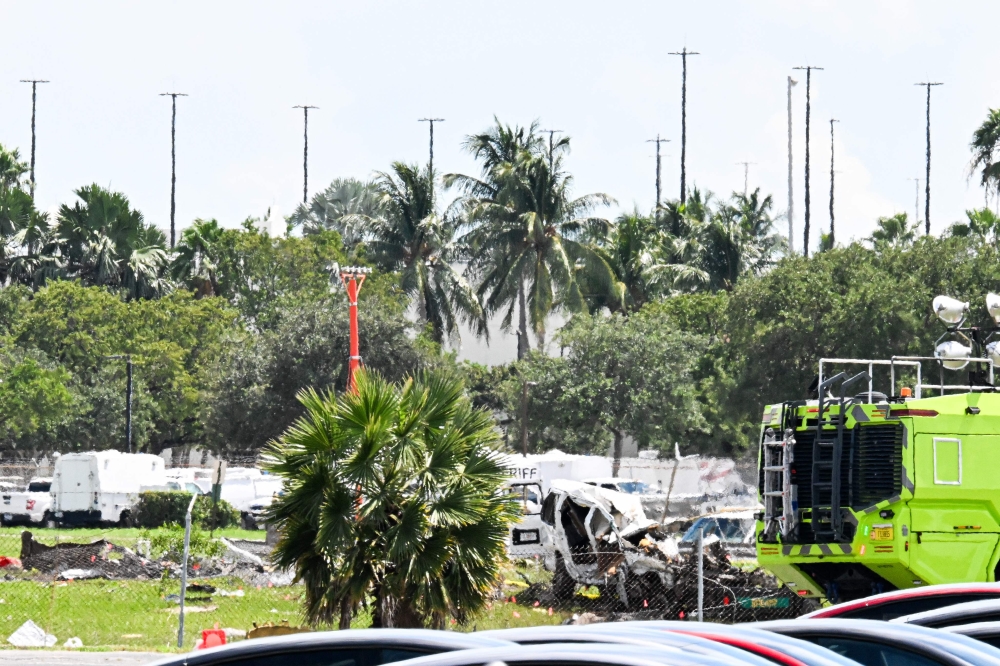 Crushed cars are seen at the scene where a Prime Air cargo plane overran the runway and struck vehicles the previous day at Miami International Airport in Miami, Florida, on September 7, 2026. — AFP pic