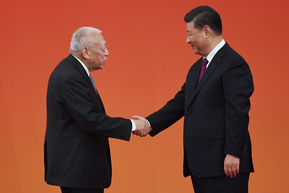 Chinese President Xi Jinping (right) shakes hands with former Hong Kong chief executive Tung Chee-Hwa during a ceremony in Beijing’s Great Hall of the People September 29, 2019. — AFP pic