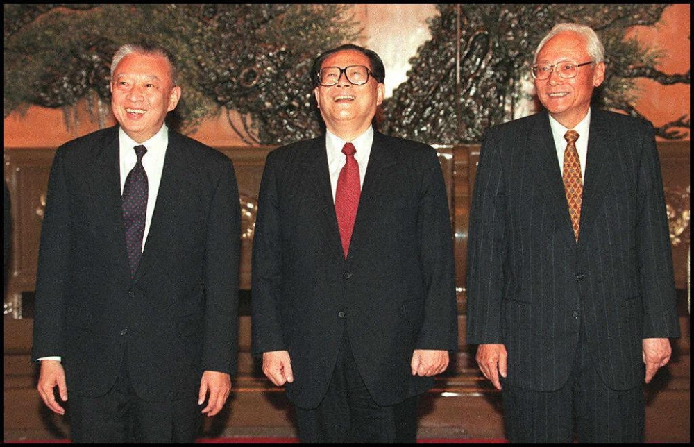 (From left) Hong Kong’s Chief Executive-elect Tung Chee-hwa laughs with Chinese President Jiang Zemin and Lu Ping, head of the Hong Kong and Macau Affairs office before a meeting at the Great Hall of the People in Beijing December 18, 1996. — AFP pic