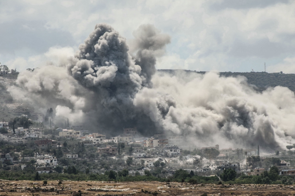 A photograph taken from the southern Lebanese village of al-Hanniyeh shows smoke as it rises from the site of an Israeli airstrike that targeted the nearby village of al-Mansouri in September 5, 2026. — AFP pic