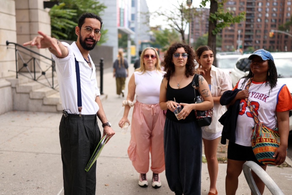 Asad Dandia conducts a guided tour about Malcolm X in the Harlem area of New York on August 22, 2026. — AFP pic 