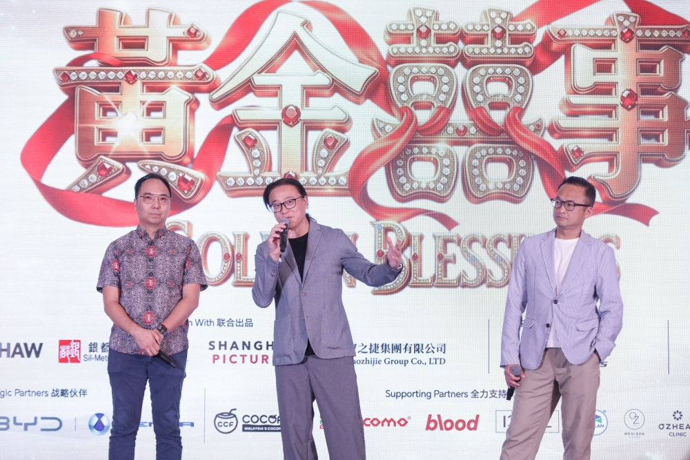 ‘Golden Blessings’ director Mak Ho Pong (far right) and writer Edmond Wong (centre) speak at yesterday’s film launch in front of industry figures and media members. — Picture courtesy of Astro Shaw — Picture courtesy of Astro Shaw