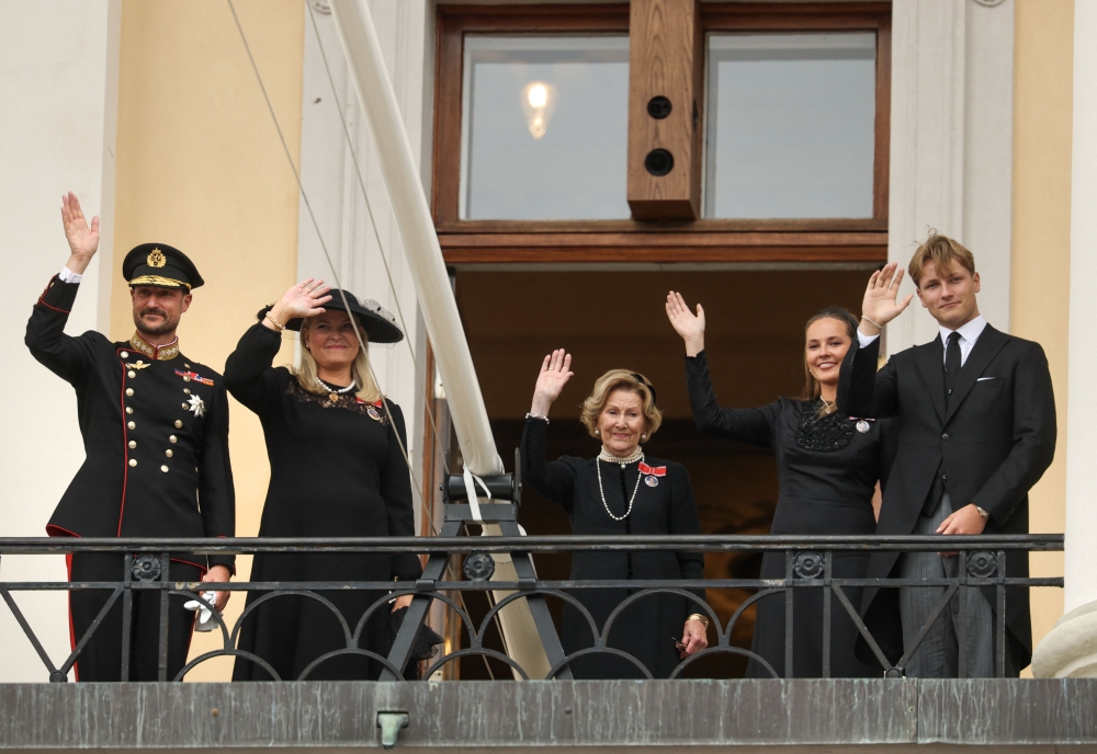 Norway’s Royal Family (from left) King Haakon VIII of Norway, Queen Mette-Marit of Norway, Queen Sonja of Norway, Crown Princess Ingrid Alexandra of Norway and Prince Sverre Magnus of Norway wave from the balcony of the Royal Palace in Oslo, Norway, after Norway’s late King Harald V was laid to rest at Akershus Castle September 9, 2026. — AFP pic