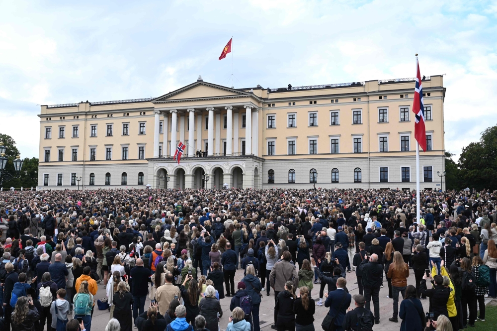 Wellwishers greet members of Norway’s Royal Family standing on the balcony of the Royal Palace after the funeral of Norway’s late King Harald V in Oslo September 9, 2026. — AFP pic