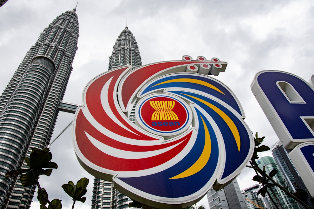 The logo of the Association of Southeast Asian Nations (Asean) is pictured in front of the Petronas Twin Towers ahead of the 47th Asean Summit in Kuala Lumpur on October 24, 2025. — Picture by Firdaus Latif