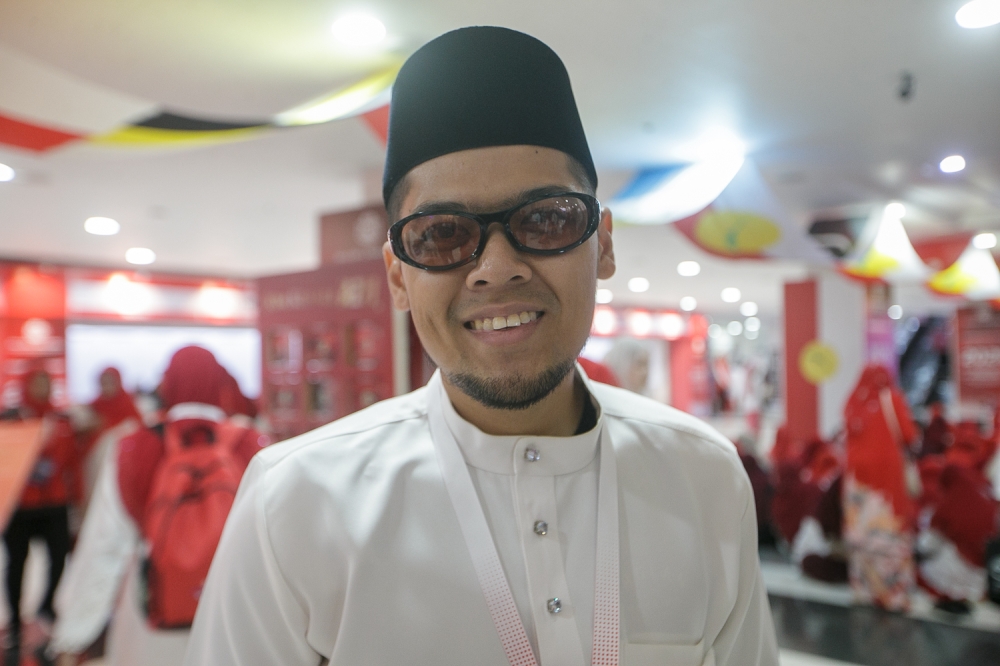 Kepong Umno division member Muhamad Ainnul Haziq Mohd Razlan, 28, speaks during an interview with Malay Mail on the sidelines of the 2026 Umno General Assembly at the World Trade Centre in Kuala Lumpur, September 10, 2026. — Picture by Raymond Manuel