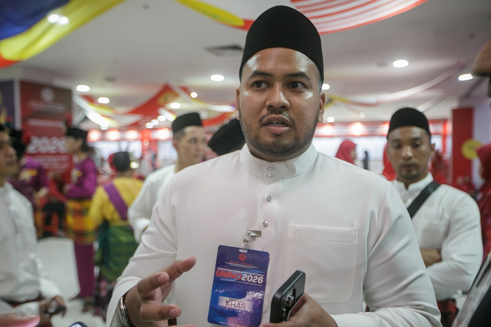 Kota Kemuning Umno Youth information chief Hirzan Alam, 29, shares his views with Malay Mail during the 2026 Umno General Assembly at the World Trade Centre in Kuala Lumpur, September 10, 2026. — Picture by Raymond Manuel