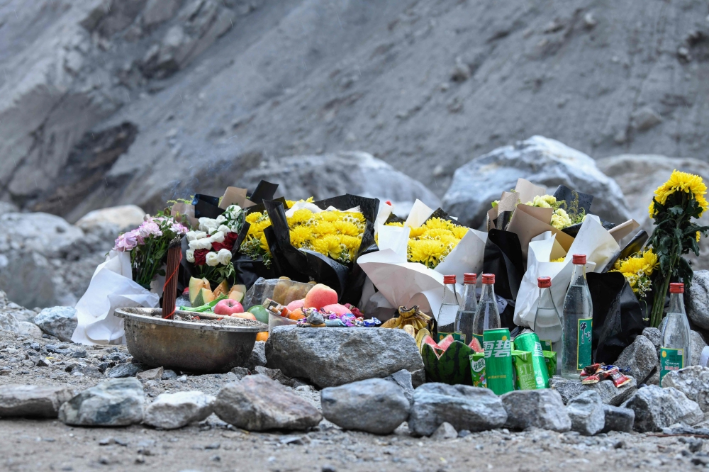 Offerings placed by workers to mourn the victims of the August 26 mudslide are seen at the site of the destroyed Gyirong Port in Gyirong County, in China’s western Tibet region on September 5, 2026. — CNS/China OUT/AFP pic