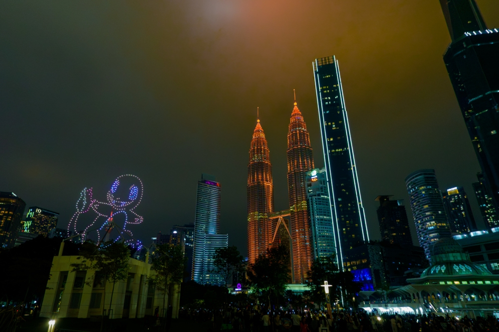 Char, char: The Petronas Towers glowed red alongside Charmander.  — Picture by Raymond Manue