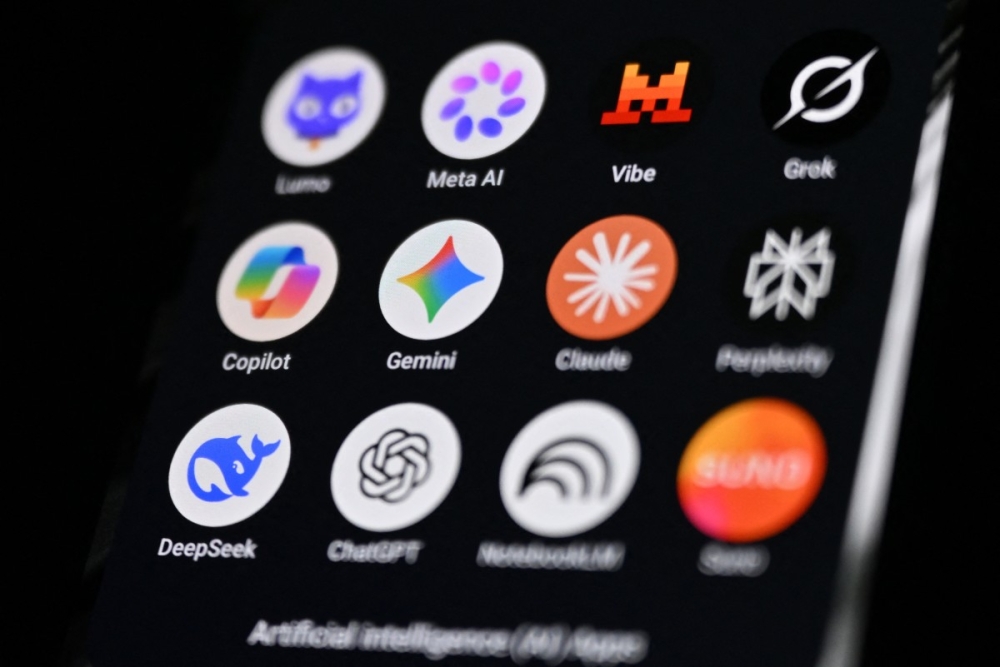 A smartphone displays icons of major AI apps including Meta AI, Grok, Copilot, Gemini, Claude, Perplexity, Deepseek and ChatGPT. — AFP pic