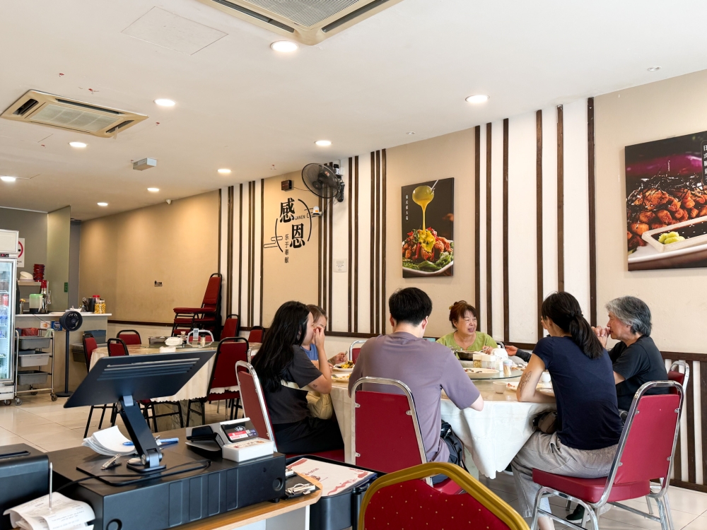 The restaurant spans two floors and seating is a mix of round family-style tables and square tables for smaller groups. — Picture by Lee Khang Yi